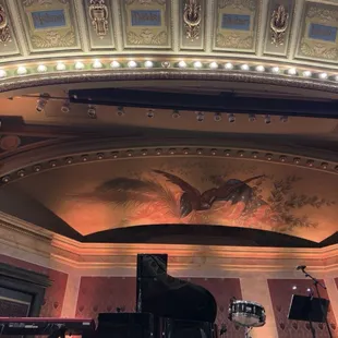 a grand piano in the center of the room