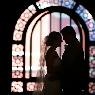 Beautiful windows and married couple (photo: Robin McKerrell Photography)
