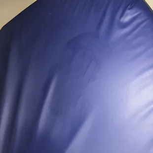 Bed that has not been wiped down prior to our visit.