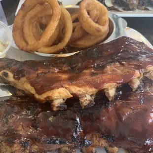 Full rack of ribs with a side of onion rings