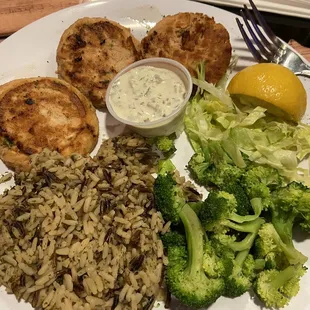 Salmon patties with steamed broccoli and rice pilaf.