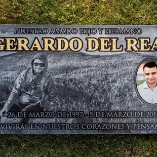 Headstone with gold leaf and ceramic tile in loving memory