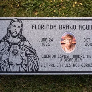 Flat headstone with ceramic tile in loving memory