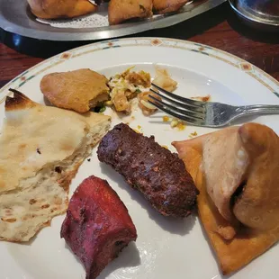 Nawabi Lukme (assorted appetizer) A combination of samosas, vegetable pakoras, chicken tikka and lamb sheekh kabob