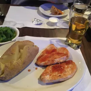 a plate of food and a glass of beer