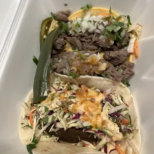 Left over carne asada taco and avocado taco