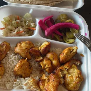 Chicken Kabob, rice, salad and pickled veggies with pita bread