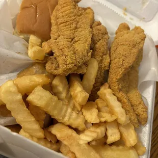 Manager&apos;s special, 5pc fish tenders, 3 whole wings (underneath), fries, bread, slaw and a drink.