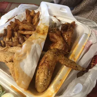 5 pieces of catfish , 3 wings (Lemon pepper and sweet honey glaze ) fries , tarter sauce , cole slaw , carrots and celery .