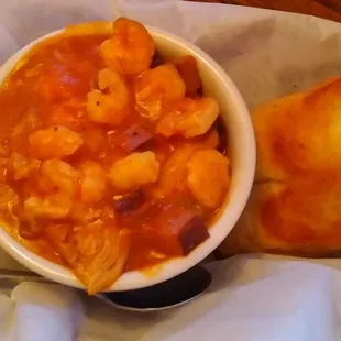 Cup of jambalaya with garlic toast