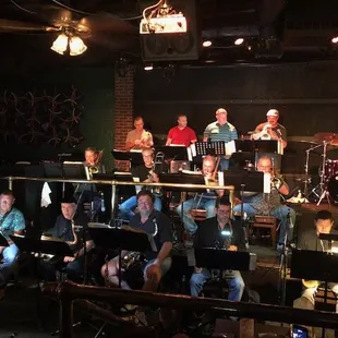 a band playing in a dimly lit room