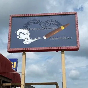 a sign for a smoking lounge