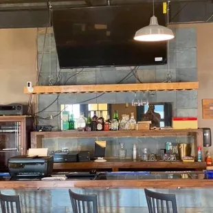 a bar with red stools