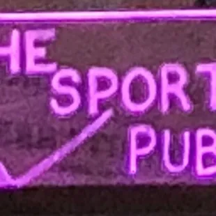 the neon sign for the sport shop