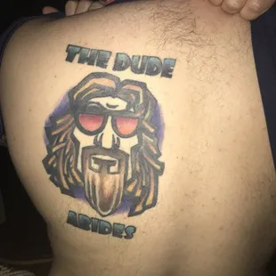 a man with a tattoo on his back