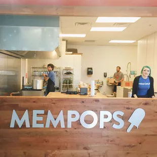 a man and a woman in a kitchen