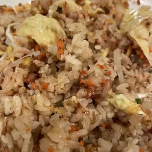 a plate of fried rice and vegetables