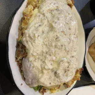 Famous German Fries with cheddar cheese and sausage gravy.