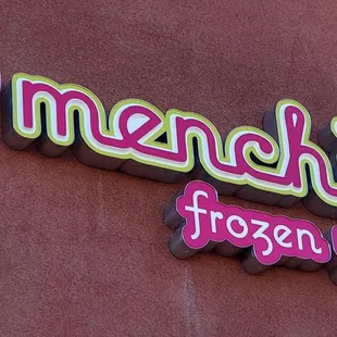 Close up of Menchie&apos;s Frozen Yogurt on their storefront (facing the parking lot).