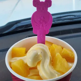 Dole pineapple whip with fresh pineapple pieces.