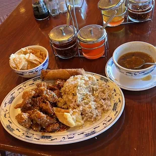 Sesame seed chicken with fried rice, egg roll , wontons and hot &amp; sour soup.