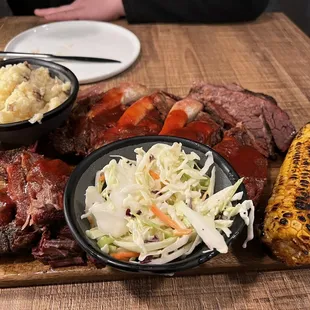 Combo platter - burnt ends, ribs and brisket. Coleslaw by default. Chose the mash and grilled corn.