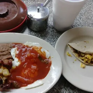 two plates of mexican food and a cup of coffee