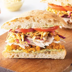 two sandwiches on a cutting board