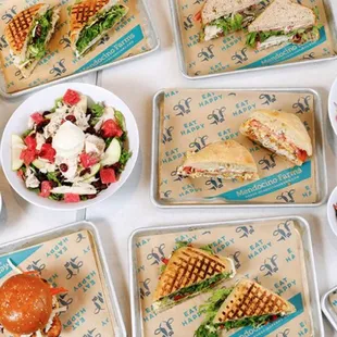 a variety of sandwiches and salads