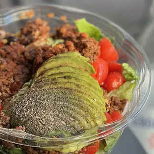 a salad in a plastic bowl