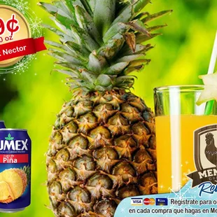 a pineapple next to a can of mango juice