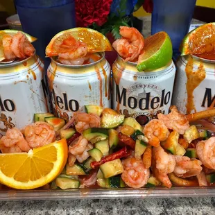 a tray of shrimp and vegetables