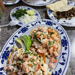a plate of shrimp and rice salad