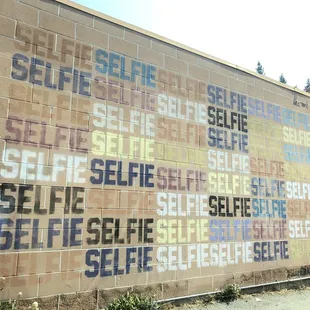 The famous selfie wall in the parking lot