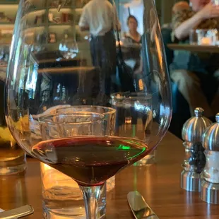 a glass of wine on a table