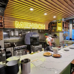 a man preparing food in a restaurant kitchen