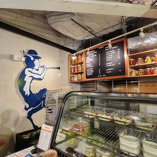 a baseball player behind a glass case