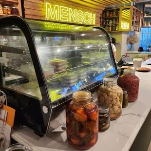 jars of pickled vegetables on a counter