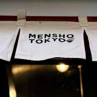 Inside Bar seating. Window view into BOH.