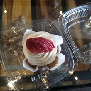 a cupcake with a strawberry on top