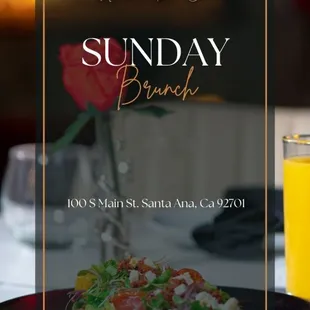 a plate of food and a glass of orange juice