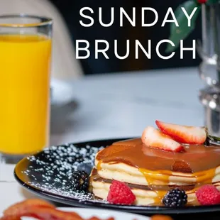 a plate of pancakes and fruit