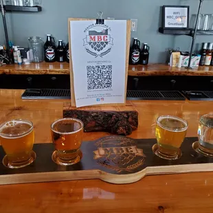 a flight of beers on a bar