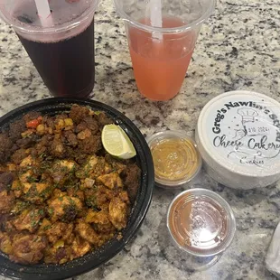 Fusion chicken &amp; beef suya bowl, 2 sauces, Sobolo drink (on the left), strawberry lemonade, Cheesecake cookies &amp; cream ice cream