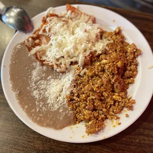 Chorizo with egg, Chilaquiles and side of retried beans