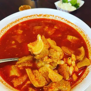 a bowl of soup with a spoon in it