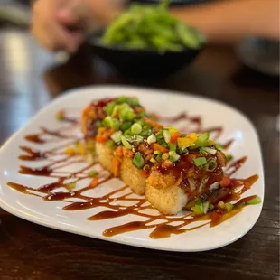 Crispy Tuna (spicy tuna over crispy rice) and Edamame.