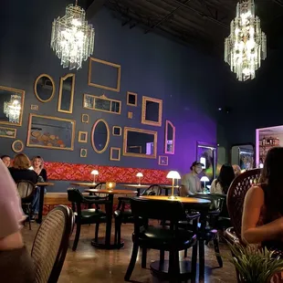 people sitting at tables in a restaurant