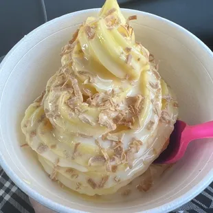 Delicious pineapple Dole Whip snow capped with toasted coconut flakes.