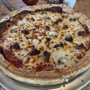 Large deep dish Italian sausage pizza.